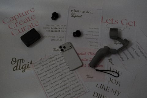 Marketing materials flat lay with printed cards and tech devices